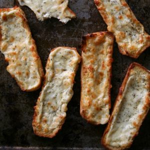 Cheesy Garlic Bread from JensFavoriteCookies.com - Leftover hot dog buns make the BEST cheesy garlic bread!