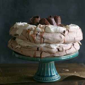 Chocolate Pavlova from JensFavoriteCookies.com  -  This chocolate meringue dessert is so impressive topped with chocolate curls!